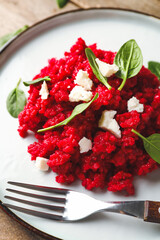 Plate with tasty beet risotto, closeup
