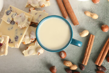 Fototapeta na wymiar Cup with hot white chocolate on color background