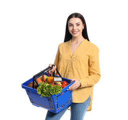 Fototapeta na wymiar Young woman with shopping basket on white background