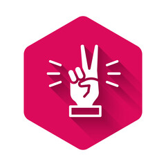 White Hand showing two finger icon isolated with long shadow. Victory hand sign. Pink hexagon button. Vector