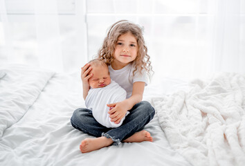 Newborn baby and sister