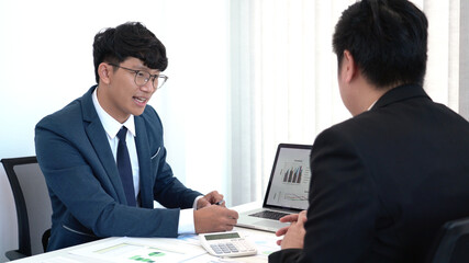Business concept a male startup entrepreneur presenting business data to an investor for the business expansion.