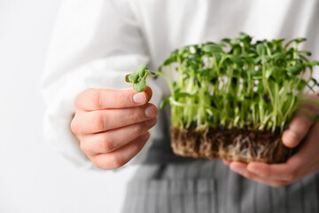 Woman with fresh micro green, closeup