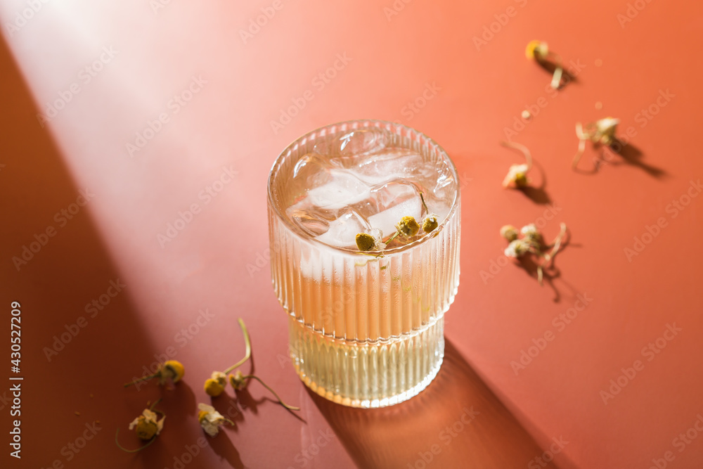 Wall mural Hard seltzer cocktail with chamomile and ice