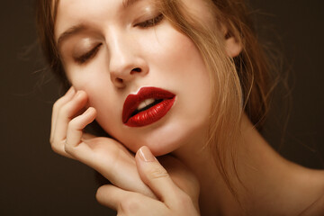 Beauty face of young woman, red lips make-up, clean skin.
