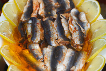 Fish fillet cooked pickled pieces with spices and lemon