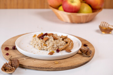 Liquid organic honey on a special spoon of honey in a bowl on a white background Close-up. Healthy food concept.