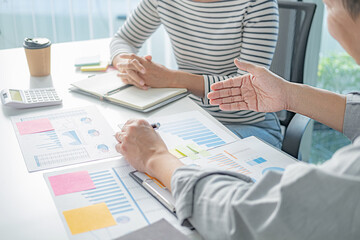 Professional investor working with new startup project. Digital tablet laptop computer design smart phone in office.