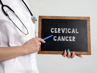 Healthcare concept meaning CERVICAL CANCER with sign on the chalkboard.