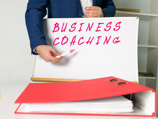 Conceptual photo about BUSINESS COACHING with written text.