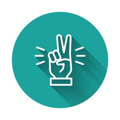 White line Hand showing two finger icon isolated with long shadow. Victory hand sign. Green circle button. Vector