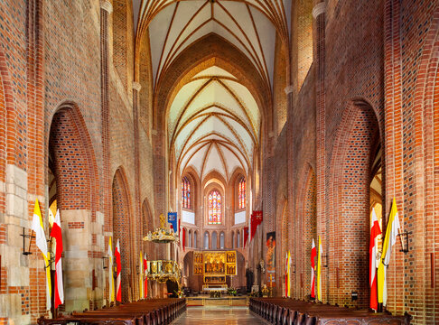 Interior of St. Peter and St. Paul Archcathedral Basilica with main nave and altar on historic Ostrow Tumski island at Cybina river in Poznan, Poland