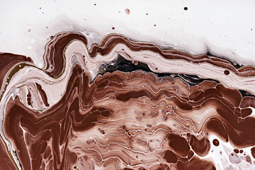 Acrylic Fluid Art. Brown waves and stains on white flowing paint. Abstract marble background or texture