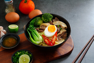 Asian Noodle Soup beef, boiled spaghetti noodles, cooked egg, vegetables home made.
