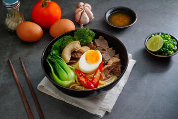 Asian Noodle Soup beef, boiled spaghetti noodles, cooked egg, vegetables home made.