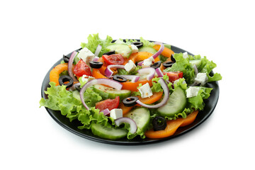 Plate of greek salad isolated on white background