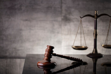 Law and justice concept. Law symbols composition: judge’s gavel, Themis  statue and scale. Gray...