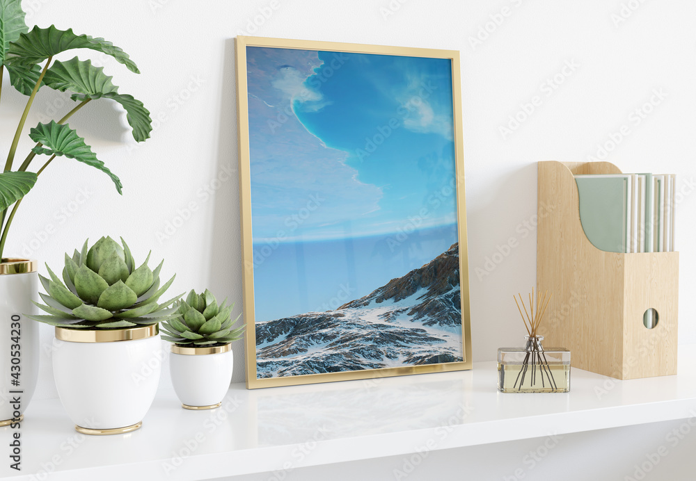 Poster golden frame leaning on white shelve in interior with plants and books mockup 3d rendering