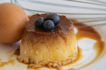 delicious egg custard with caramel on white plate