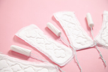 Menstrual pad on a pink background.