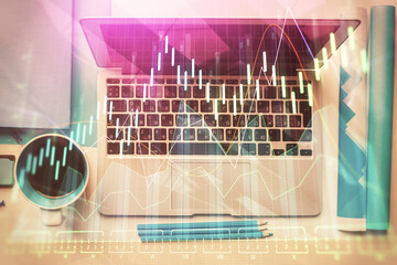 Double exposure of forex graph drawing over desktop background with computer. Concept of financial analysis. Top view.