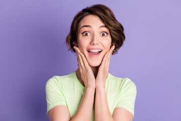 Fototapeta premium Close-up portrait of nice attractive amazed cheerful girl good news reaction isolated over bright violet purple color background