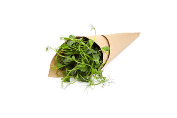 Microgreens pea in paper cone isolated on white background