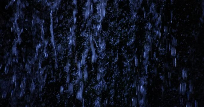 A slow motion of water fall in the forest daytime