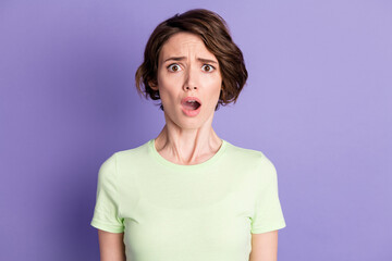 Fototapeta premium Portrait of attractive worried desperate girl bad news reaction isolated over bright violet purple color background