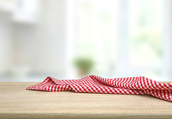 Empty table decorated with red checkered towel food advertisement display. Tabletop with empty...