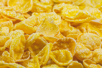 Yellow Cornflakes close up photo, Food texture background, top view. Macro shot. Perfect breakfast.