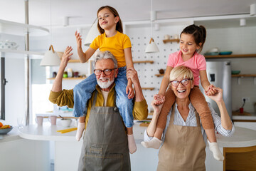 Family, generation love and people concept. Happy grandparent having fun with children at home