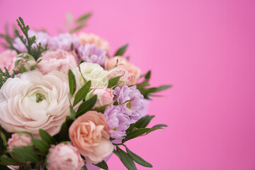Beautiful bouquet of mixed different flowers on pink background, greeting, gift