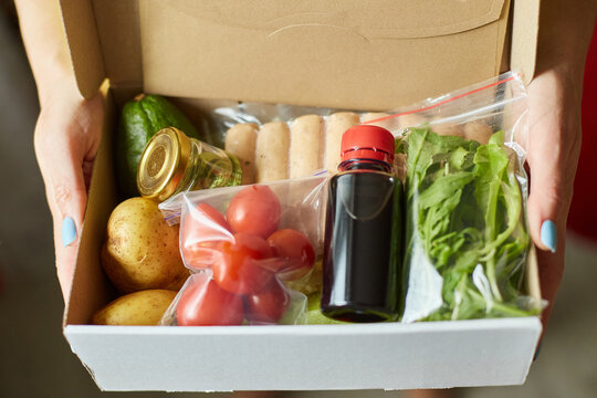 Woman Hold In Hand  Food Box Meal Kit Of Fresh Ingredients Order From A Meal Kit Company, Delivered, Cooking At Home.