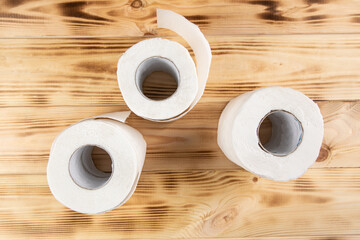 toilet paper on wooden background