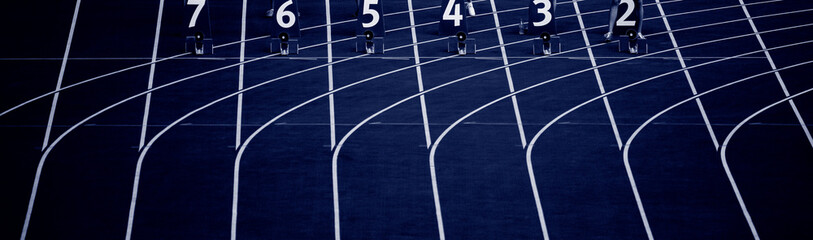 Starting blocks in track and field. Professional sport concept. Blue color filter