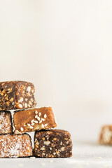 Homemade vegan healthy sugar free candies made of dried fruits. Copy space.