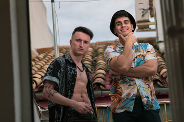 young hippies posing in extravagant clothes