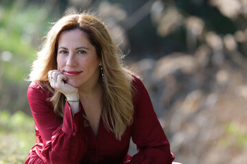 woman portrait outdoors with red dress