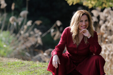 woman portrait outdoors with red dress