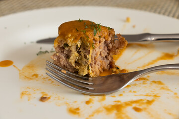 plate with cutlet and gravy close-up