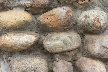 a wall of large gray stones