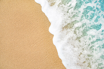 Close up soft wave lapped the sandy beach, Summer Background. - obrazy, fototapety, plakaty