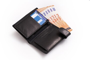 Gentleman's wallet with banknotes peeking out and credit cards on white background