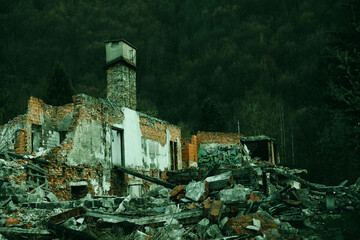 Ruins of the destroyed building in the mountains.