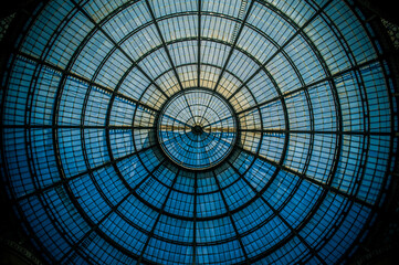 Abstract circular pattern of the glass dome of the Galleria Vittorio Emanuele II in Milan, Lombardy, Italy.