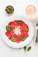 Beef carpaccio with capers and parmesan cheese