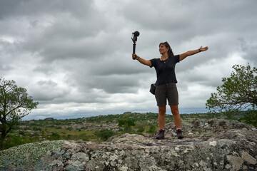 Young biology woman scientist travel and reseach kind of minerals. climber practice on rock wall survey study nature