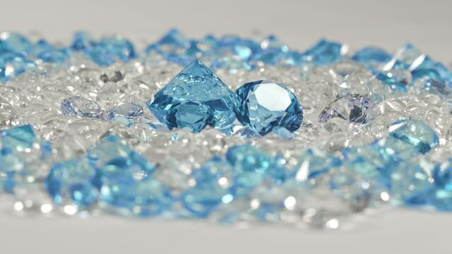 .A group of aquamarine blue diamonds arranged in the middle of white diamonds on a white background.