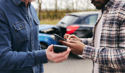 Senior Male Driver Exchanges Car Insurance Details With Younger Motorist After Road Traffic Accident